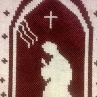 tekstiilityö, kuva-aiheena rukoilija